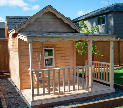 Image of left side of playhouse with hexagon window